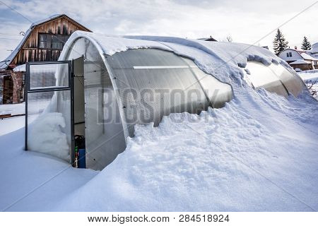 Snow-swept Greenhouse Made Of Polycarbonate In The Country. Berdsk, Novosibirsk Region, Western Sibe