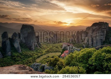 Monastery Meteora Greece. Stunning Spring Panoramic Landscape At Sunset. View At Mountains And Green