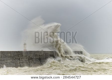 Stunning Waves Crashing Over Harbor Wall During Windy Storm At Newhaven On English Coast