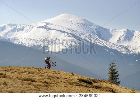 Rider Among  Fantastic Snow Peaks