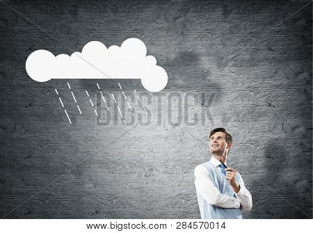 Horizontal Shot Of Confident And Young Businessman In Smart-casual Wear Smoking Pipe While Standing 