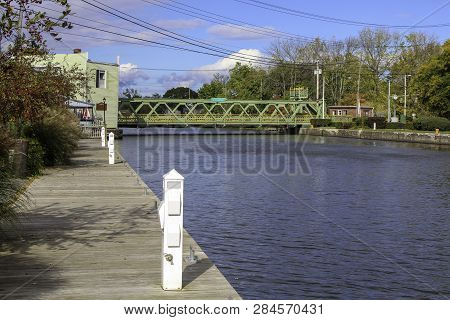 Liftbridge On The Erie Canal At Spencerport, Ny. Boat Dock On The Canal In Early Autumn.