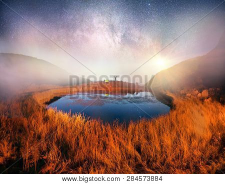 Cyclist In The Mountains At Night