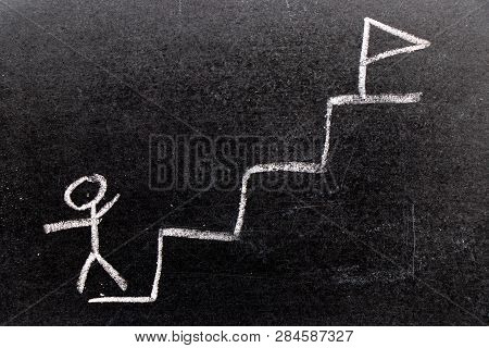 White Chalk Hand Drawing In Staricase With Man At The Ground And Flag At The Top Shape On Black Boar