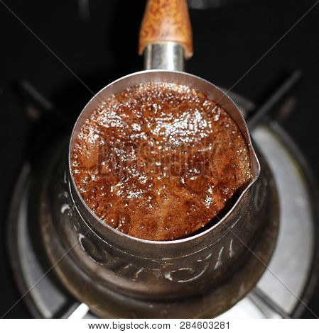 Coffee Is Prepared In The Turka, Coffee Pot, Coffee Maker, At Home. It Boils, Foam Appears. Turka Fo