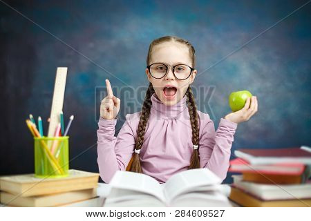 Pretty Caucasian Elementary Studentgirl Do Homework. Happy Primary Learner Get Brilliant Idea. Littl
