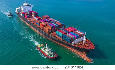 Container Ship Arriving In Port, Tug Boat And Container Ship Going To Deep Sea Port, Logistic Busine