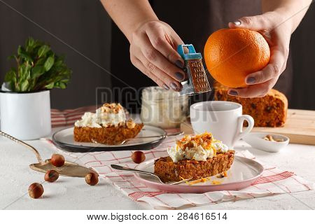 Carrot Fruit Cake. Girl Decorates Carrot Cake.