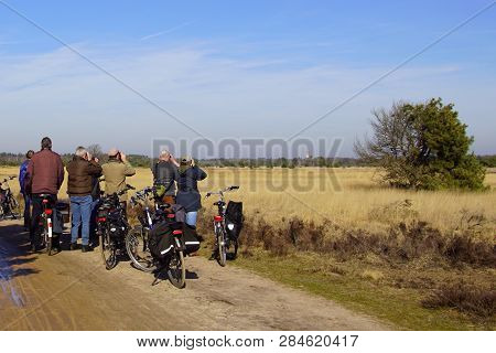 Mierlo, The Netherlands - February 16, 2019: Unknown And Unrecognizable Birdwatchers Standing Beside