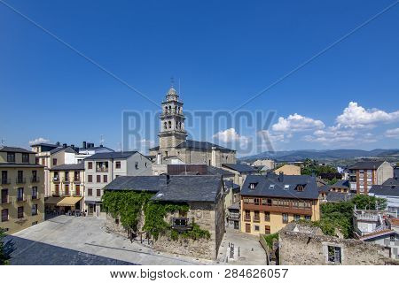 Ponferrada, Leon, Spain; June 2017: View Of Belltower Of The Basilica Of The Encina And A Watch Towe