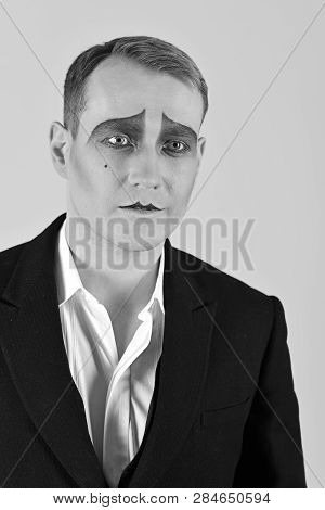 Dramatic And Tragic. Unhappy Mime With Face Paint. Theatre Actor Miming. Mime Artist. Man With Mime 