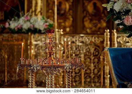 Candil Inside The Church With Burning Candles