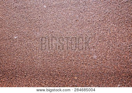 The Backdrop Of Rusted Brown Steel Plate Has Rough Surface.