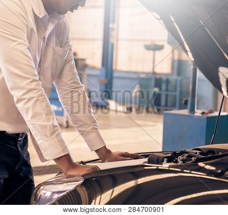 This Career Man Saleman Business Inspection Writing Note On Notepad Or Book, Paper With Car Blurry B