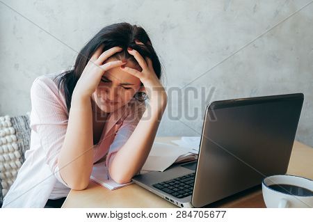 Tired Upset Young Businesswoman Suffering From Strong Chronic Headache Migraine Or Memory Loss At Wo