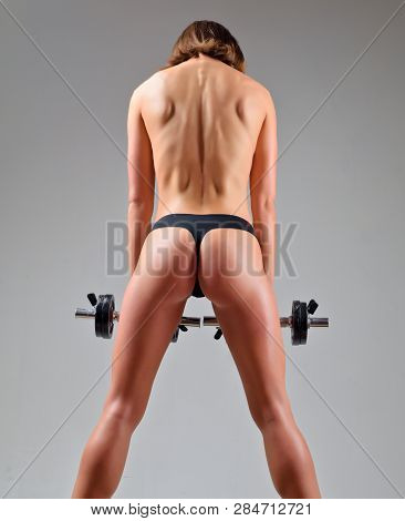 Female Fitness Model. Middle Eastern Female In Sports Clothing Workout. Sporty Girl Workout In Gym. 