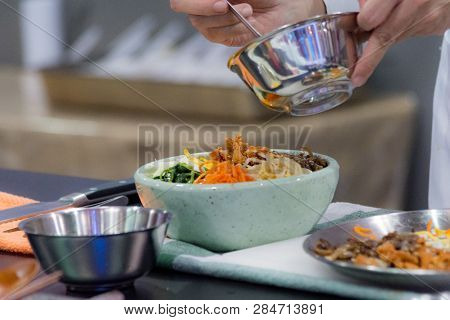 Bibimbap, Traditional Korean Cuisine Bibimbap, Chef Preparing Korean Food, Chef Cooking In Kitchen