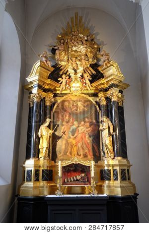 WURZBURG, GERMANY - JULY O4, 2018: Saint Peter and Paul altar in the Neumunster Collegiate Church in Wurzburg, Germany