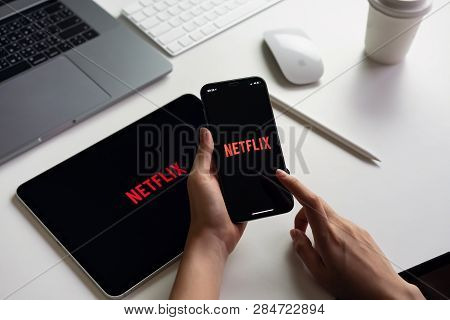 Bangkok, Thailand - March 11, 2019 : Women Use Netflix App On Smartphone Screen. Netflix Is An Inter