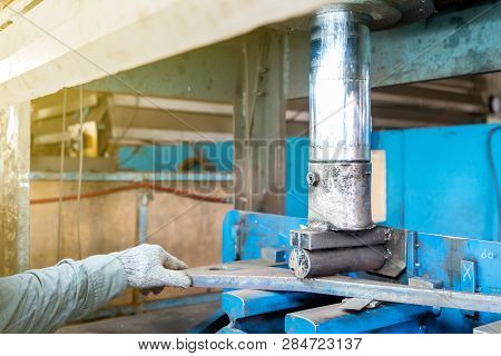 Close Up Product During Press Down By Manual Hydraulic Bending Machine At Factory
