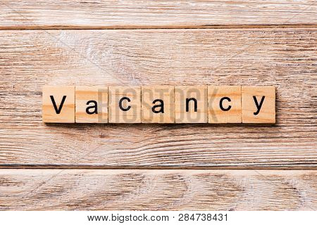 Vacancy Word Written On Wood Block. Vacancy Text On Wooden Table For Your Desing, Concept