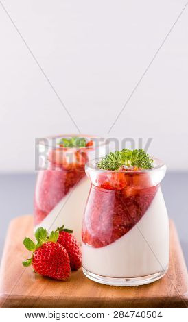 Delicous And Nutritious Double Color (colour) Strawberry Desserts With Mint And Diced Sarcocarp Topp