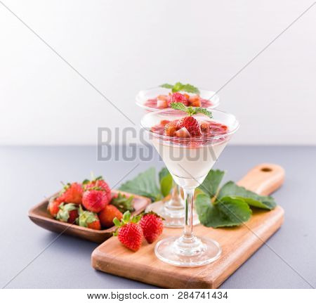 Delicous And Nutritious Double Color (colour) Strawberry Desserts With Mint And Diced Sarcocarp Topp