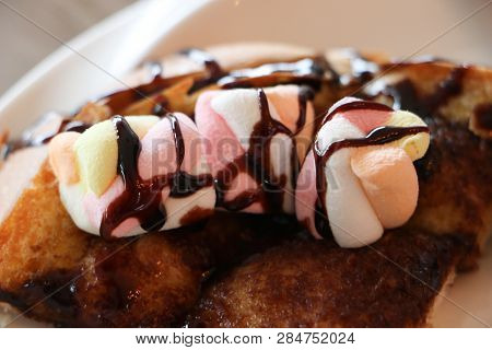 A Marshmallow Is A Sugar-based Confectionery That In Its Modern Form Typically Consists Of Sugar, Wa