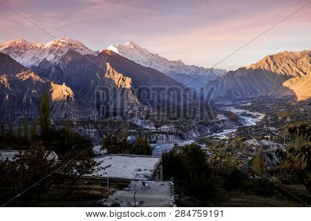 Sunrise At Hunza Nagar Valley. Morning Sunlight Shining At Snow Capped Rakaposhi Mountain In Karakor
