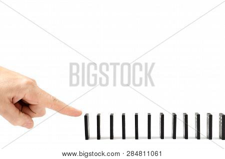 Finger, Human Hand Drops The Bones Of Dominoes On A White Background. Fall, Collapse, Coercion, Copy