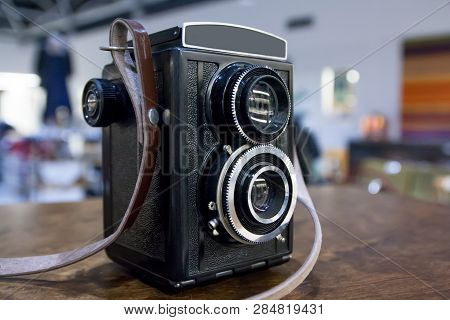 Vintage Twin Lens Camera On The Table.
