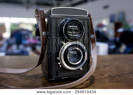 Vintage Twin Lens Camera On The Table.