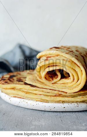 Norwegian Potato Pancakes Lefse On A Light Background With Cheese And Greens. Traditional Scandinavi