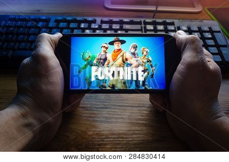 Kostanay, Kazakhstan, January 29, 2019.person Looks At The Screen Saver Of The Popular Game Fortnite