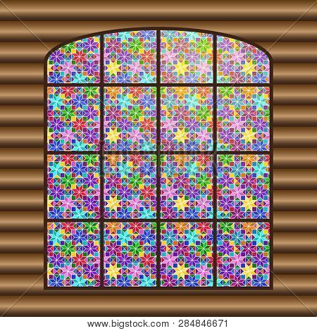 Antique Large Window With A Multi-colored Stained-glass Window Against The Background Of The Log Wal