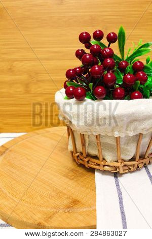 Red Round Berry, Green Leaves On Brown Round Chopping Board