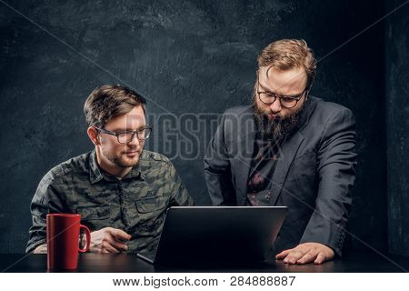 Two Programmers Are Thinking Hard, Trying To Find A Solution To The Problem In Office Against The Ba
