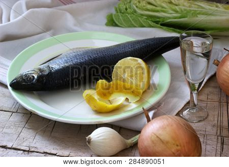 Still Life Of Herring, Lemon, Onion And Vodka. Rustic Style.