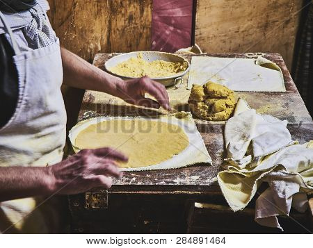Cook Making Tortillas On A Wooden Rustic Table.
