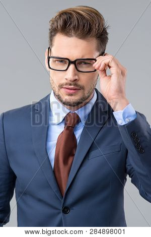 Elegant Man Wear Dark Siut And Glasses