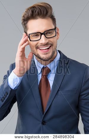 Elegant Man Wear Dark Siut And Glasses