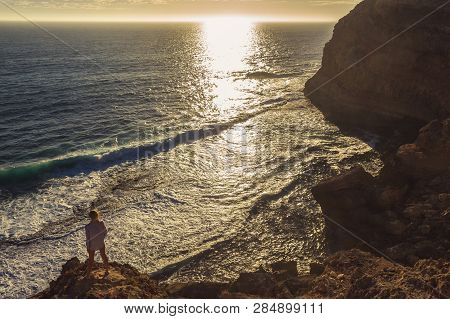 Jung Women Standing On Cliffs Near Port Lincon At Sunset, South Australia