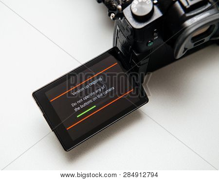Paris, France Sep 30, 2017: Camera Display Showing Firmware Update Process On The Screen On Modern P