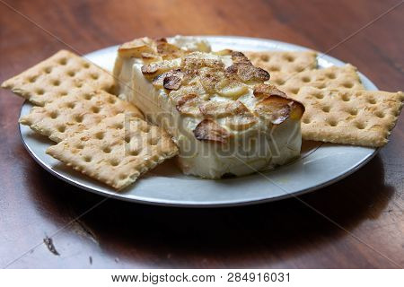 Garlic And Cheese Dip And Cookies With Wooden Background