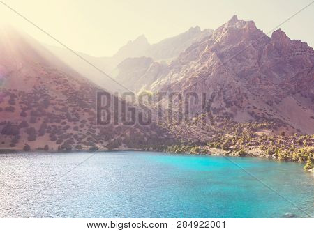 Beautiful serene lake in  Fanns mountains (branch of Pamir) in Tajikistan.