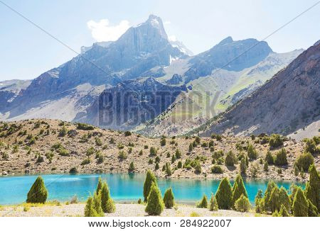 Beautiful serene lake in  Fanns mountains (branch of Pamir) in Tajikistan.
