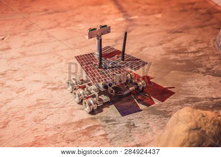 The Boy Controls The Toy Rover On Mars. Flight To Mars Concept