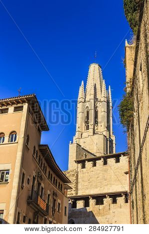 Bell Tower Of Collegiate Church Of St. Felix From Pujada De Sant Feliu Street