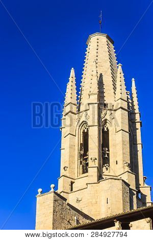 Bell Tower Of Collegiate Church Of St. Felix From Pujada De Sant Feliu Street