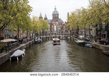 Amsterdam, Netherlands - April 20, 2017:  The Sint-nicolaaskerk (church Of St Nicholas) At The End O